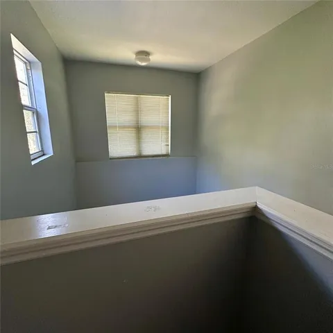 a bathroom with a toilet and a bathtub