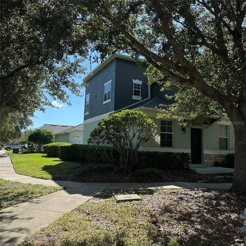 a house with a tree in front of it
