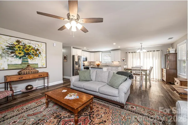 a living room with furniture and a table