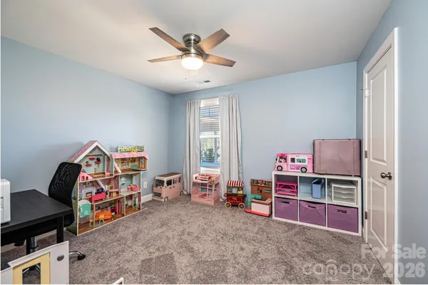 a view of a workspace with furniture and toys