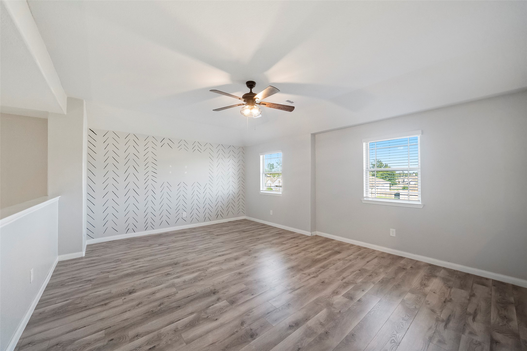 6161 White Oak Leaf Loop Conroe, TX 77303 - Photo 25 of 25 an empty room with fan and windows