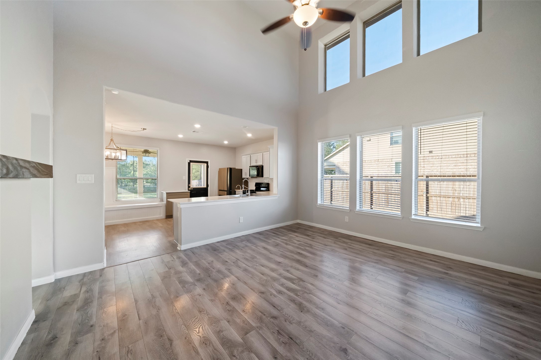 6161 White Oak Leaf Loop Conroe, TX 77303 - Photo 6 of 25 a view of livingroom with hardwood floor and a ceiling fan