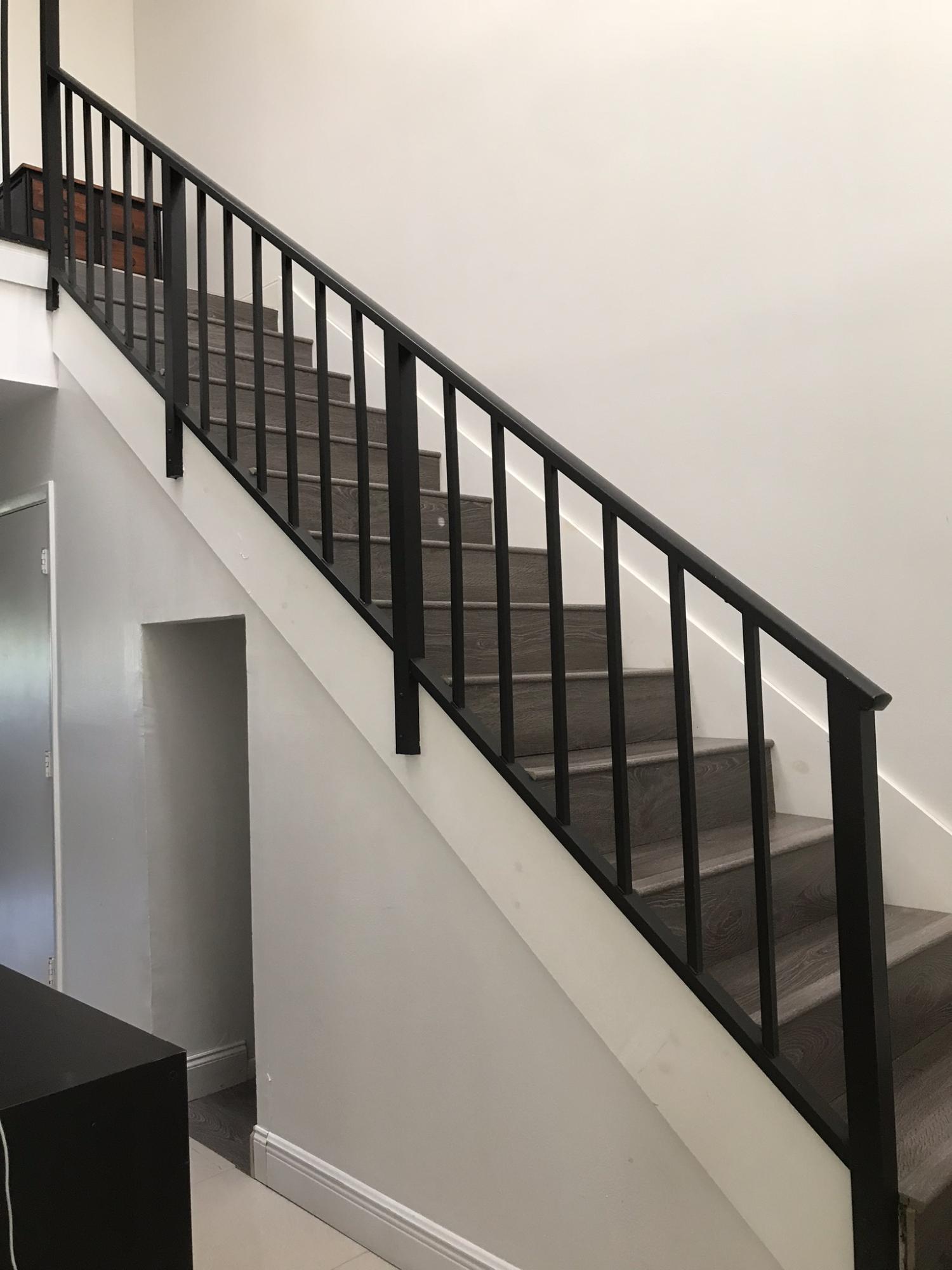23286 Southwest 54th Way, Unit E Boca Raton, FL 33433 - Photo 15 of 24 Laminate flooring on stairs