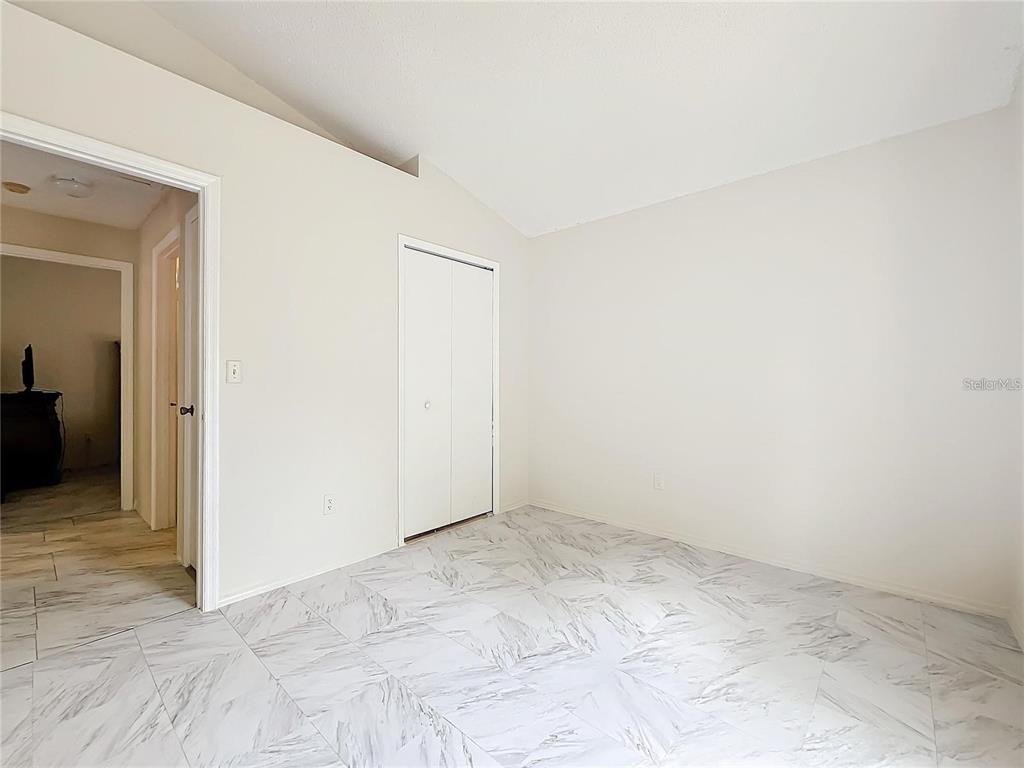 5633 Piney Ridge Drive Orlando, FL 32808 - Photo 15 of 18 an empty room with an empty room