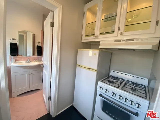 a kitchen with a stove and a cabinet