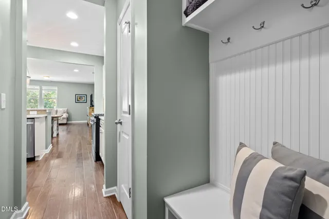 a view of a livingroom with furniture and hardwood floor