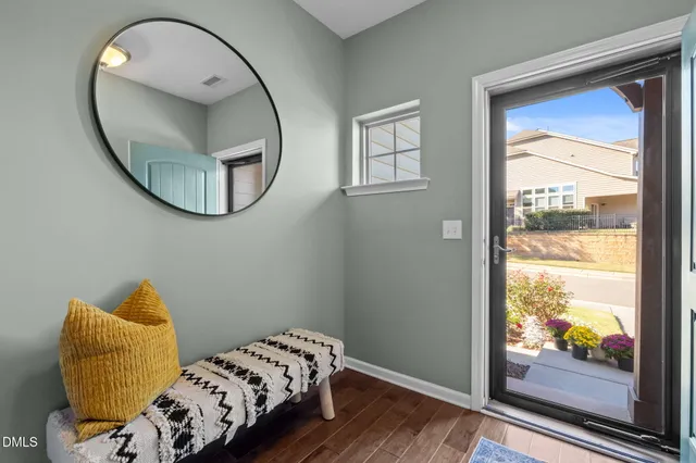 a bedroom with a bed and a mirror