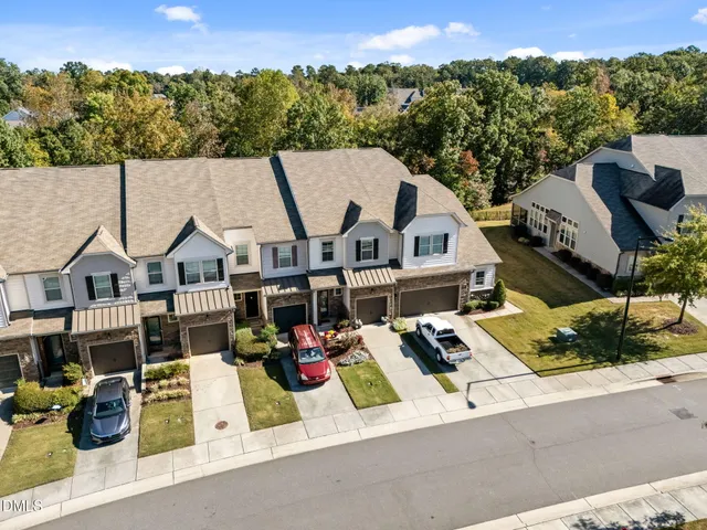 a view of multiple houses with a city view