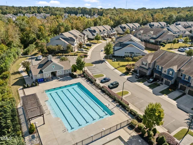 an aerial view of a house with a ocean view