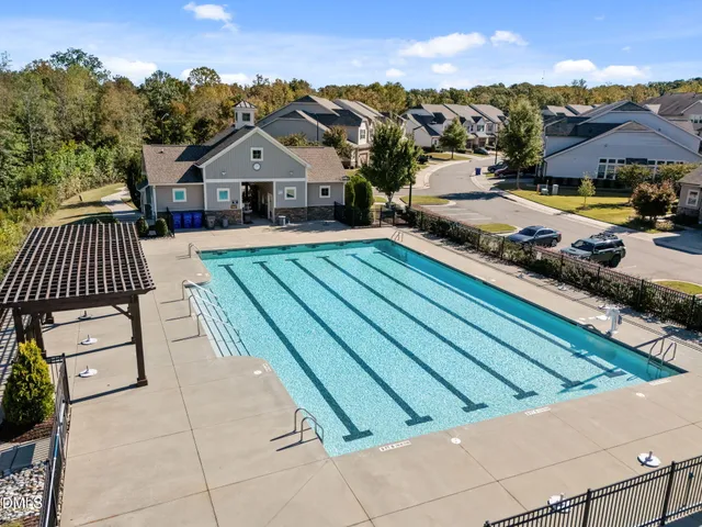 a aerial view of a house with a yard