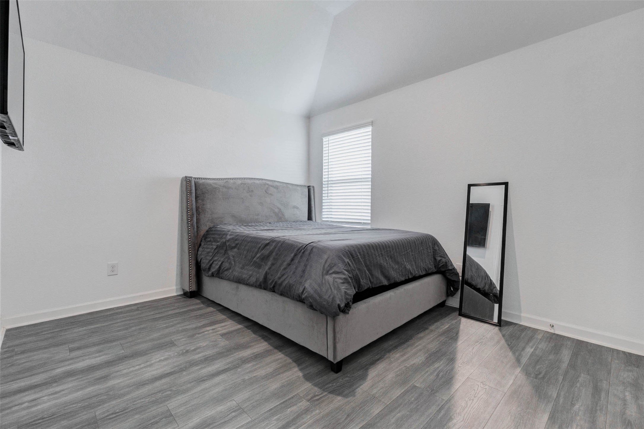 3711 Castle Rock Drive Rosenberg, TX 77469 - Photo 38 of 46 a large bedroom with a bed and wooden floor