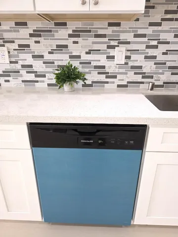 a bathroom with a toilet sink vanity and mirror