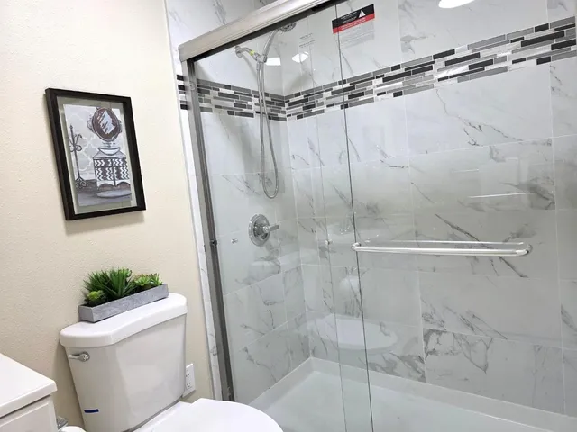 an empty room with wooden floor and closet