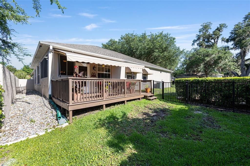 3304 Southwest 38th Street Ocala, FL 34474 - Photo 4 of 21 a view of a house with backyard and a hammock