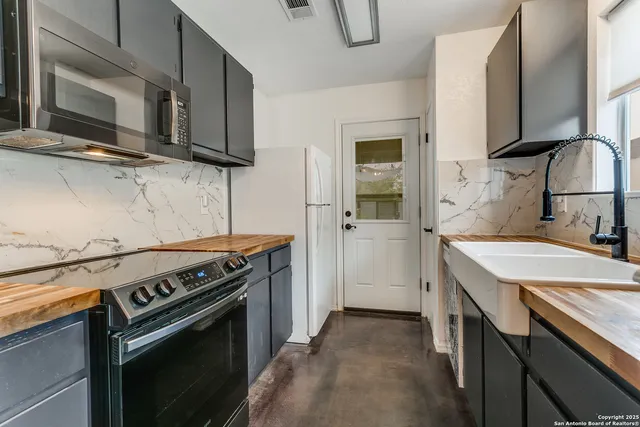 a kitchen with a stove and a microwave