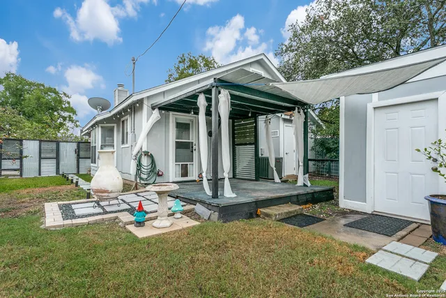 a front view of house with yard outdoor seating and barbeque oven