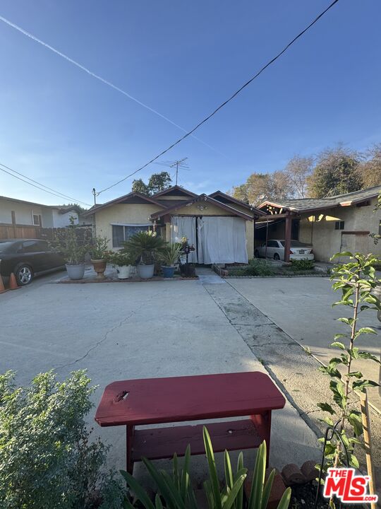 349 North Reno Street Los Angeles, CA 90026 - Photo 4 of 5 a patio with a table and chairs under an umbrella