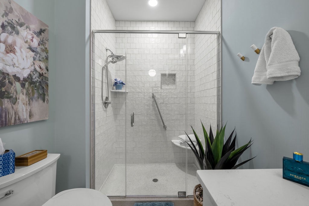 1201 Front Avenue, Unit 322 Columbus, GA 31901 - Photo 36 of 54 a bathroom with a shower a sink and a potted plant