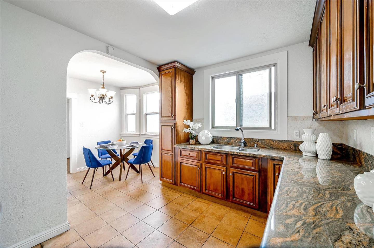 111 Genebern Way San Francisco, CA 94112 - Photo 15 of 37 a kitchen with stainless steel appliances granite countertop sink stove and granite counter top