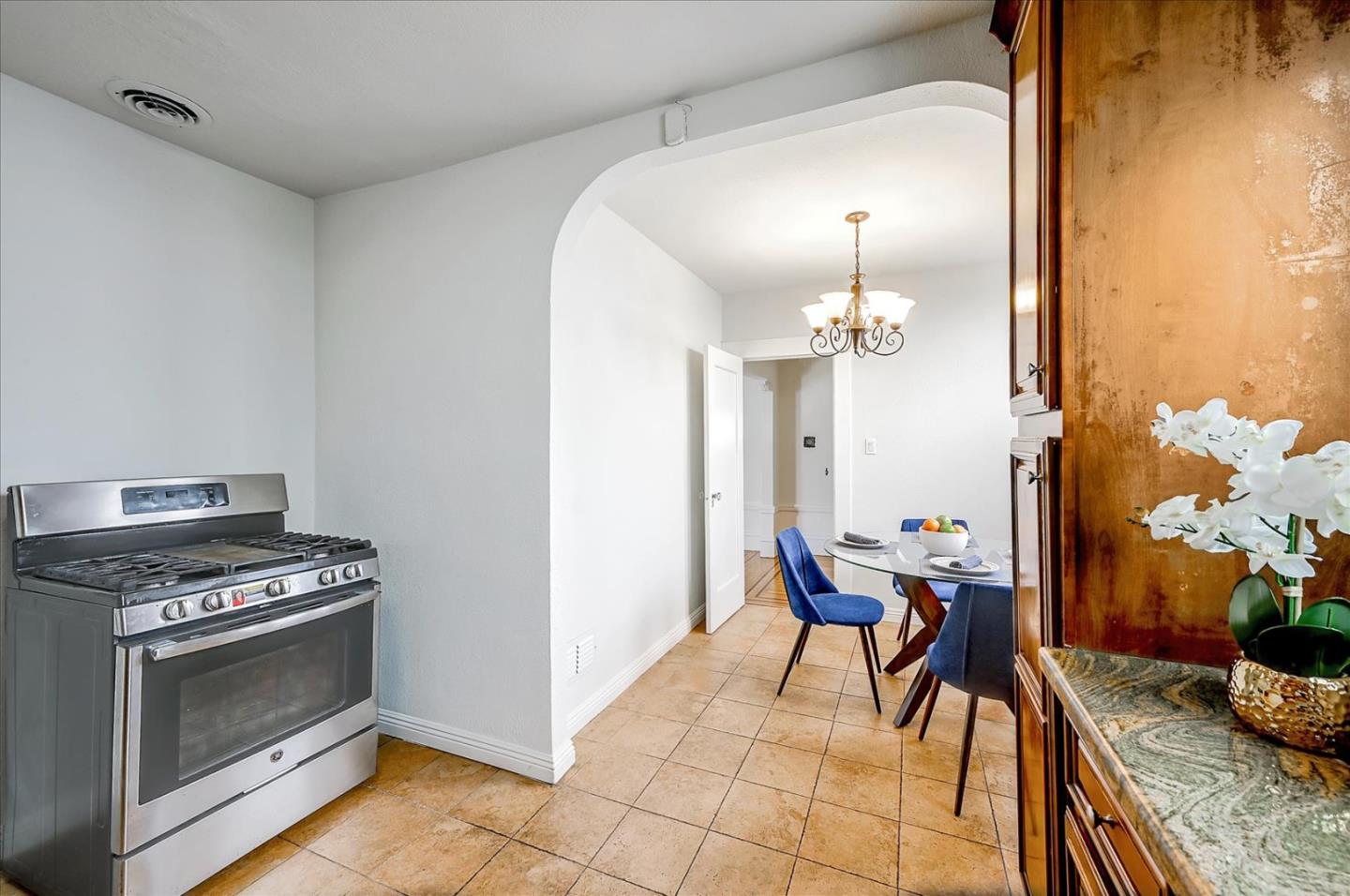 111 Genebern Way San Francisco, CA 94112 - Photo 16 of 37 a view of a dining room with furniture and chandelier