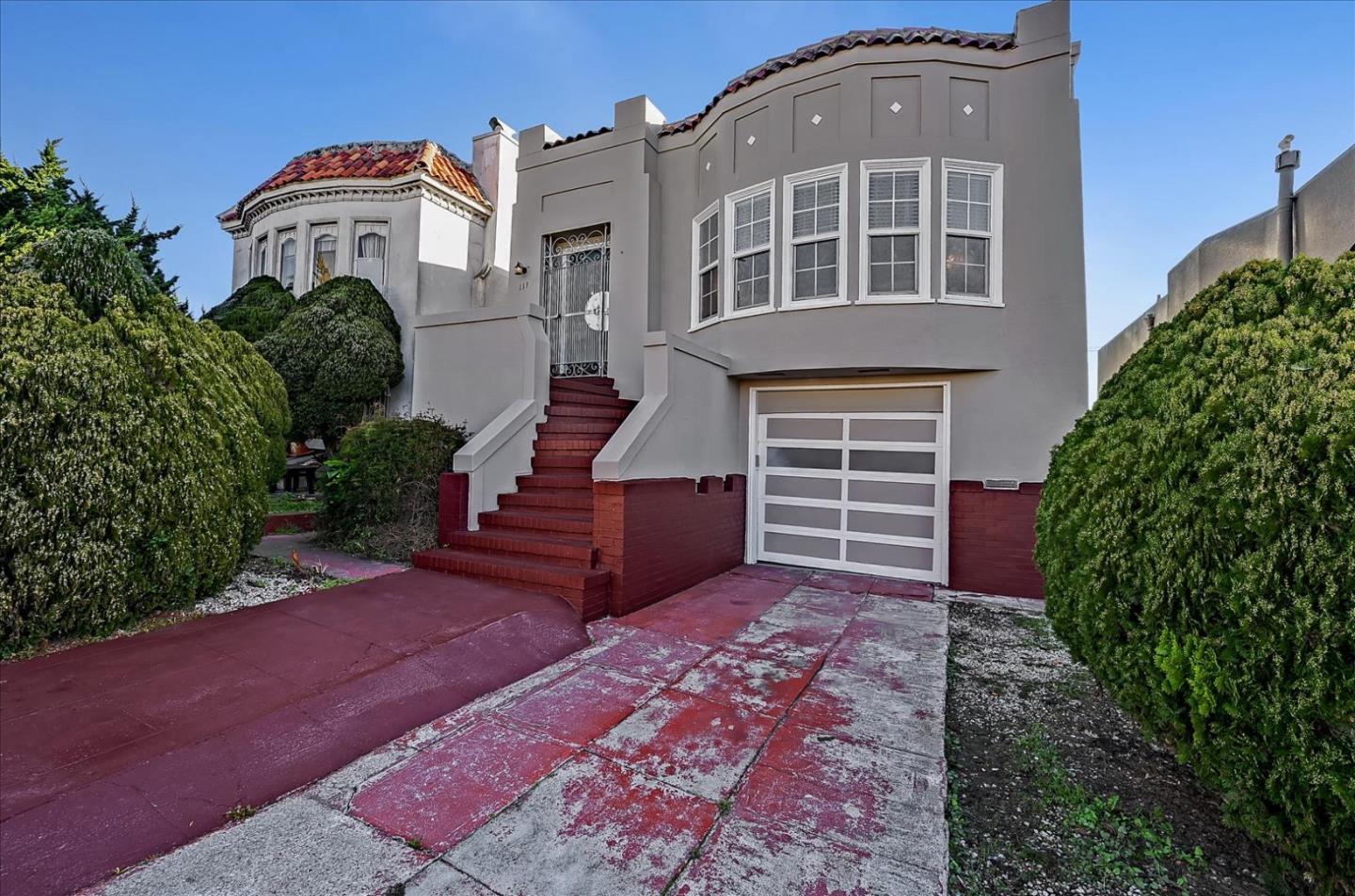 111 Genebern Way San Francisco, CA 94112 - Photo 2 of 37 a front view of a house with a yard and garage