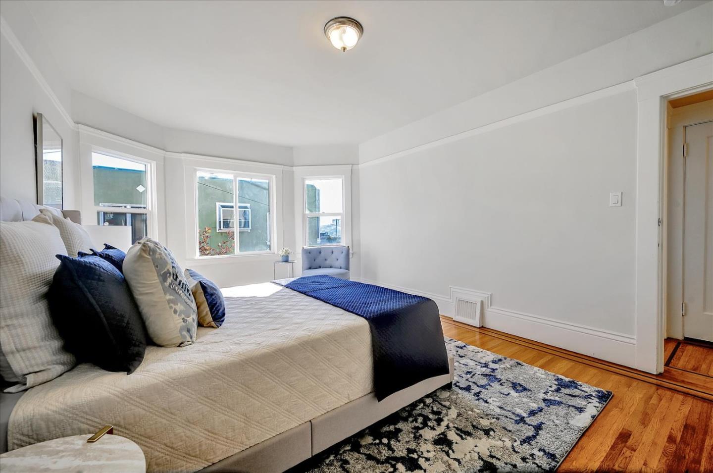 111 Genebern Way San Francisco, CA 94112 - Photo 31 of 37 a bedroom with a bed and a window