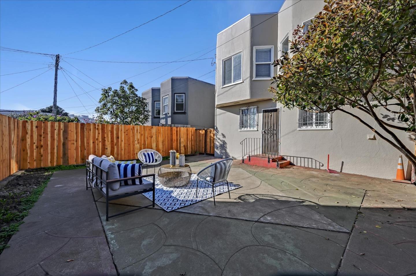 111 Genebern Way San Francisco, CA 94112 - Photo 35 of 37 a view of backyard with seating space and wooden fence
