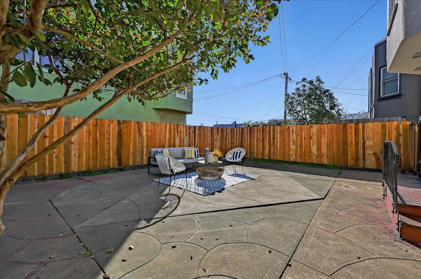 111 Genebern Way San Francisco, CA 94112 - Photo 36 of 37 a view of patio with table and chairs with wooden fence and plants