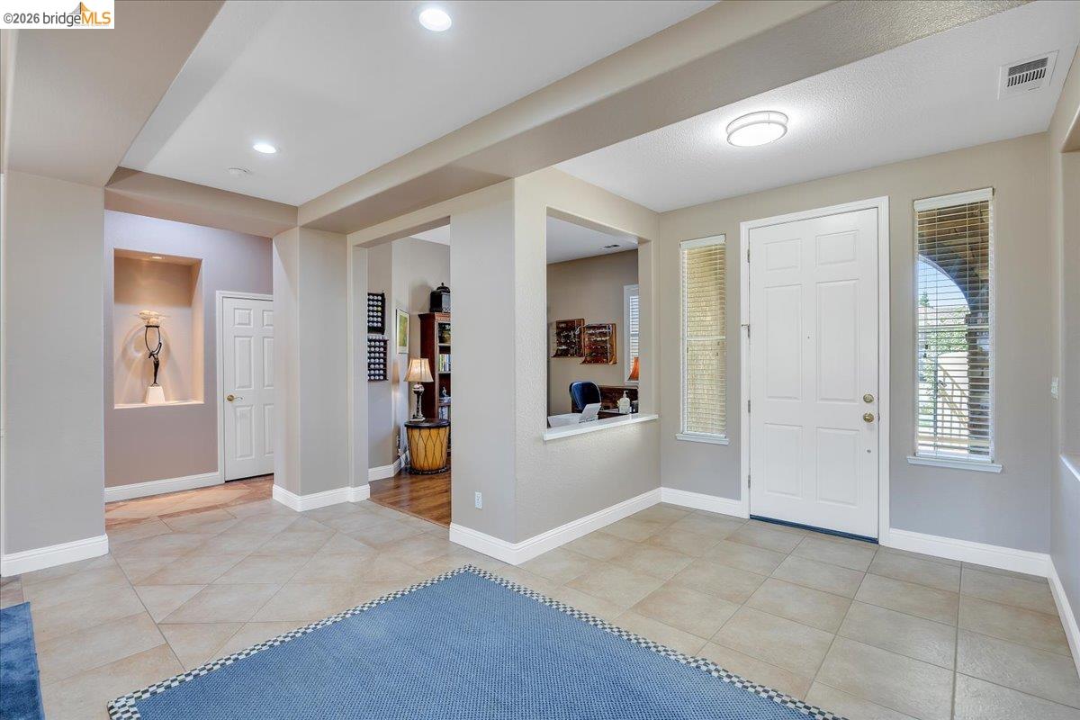 158 Rock Ridge Lane Copperopolis, CA 95228 - Photo 11 of 72 Foyer featuring large format tile flooring, recessed lighting, and a prominent front entry door with side windows
