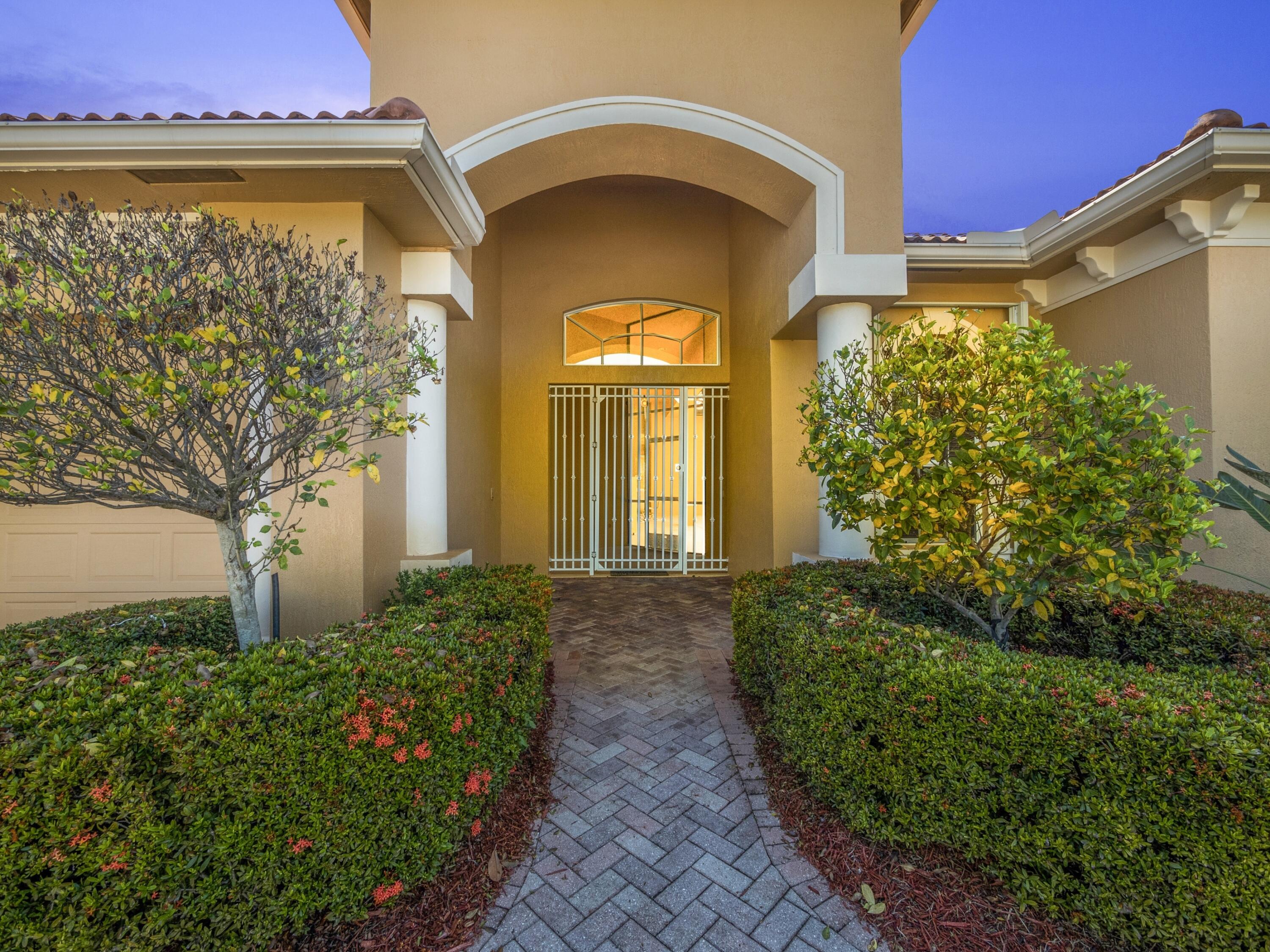 8608 Tompson Point Road Port St. Lucie, FL 34986 - Photo 6 of 50 Exterior Front Night Shot