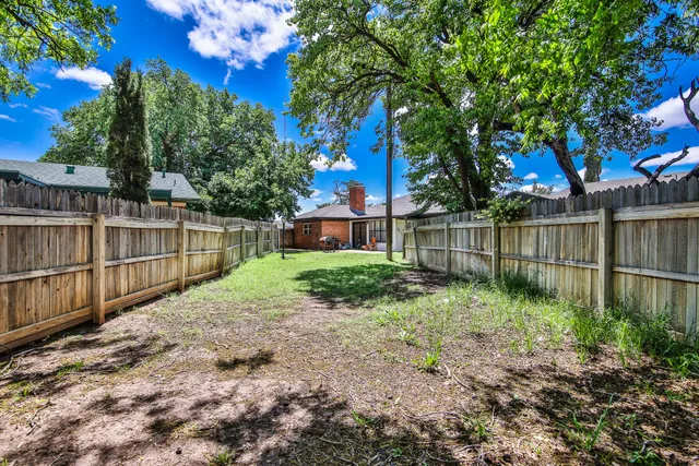 a view of a backyard with a garden
