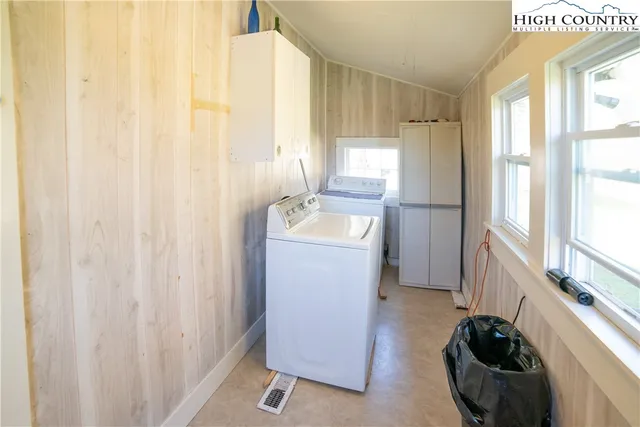 a utility room with a window dryer and washer