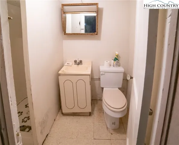 a bathroom with a toilet and a sink