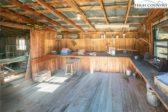 a view of a room with wooden floors