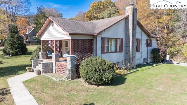 a view of a yard and front view of a house