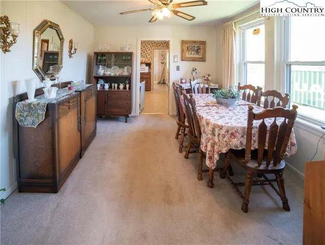 a dining room with furniture and window