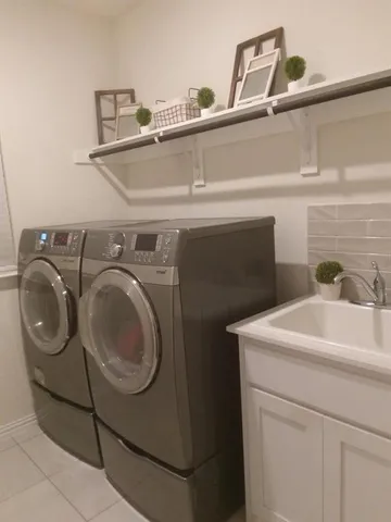 a utility room with dryer and washer