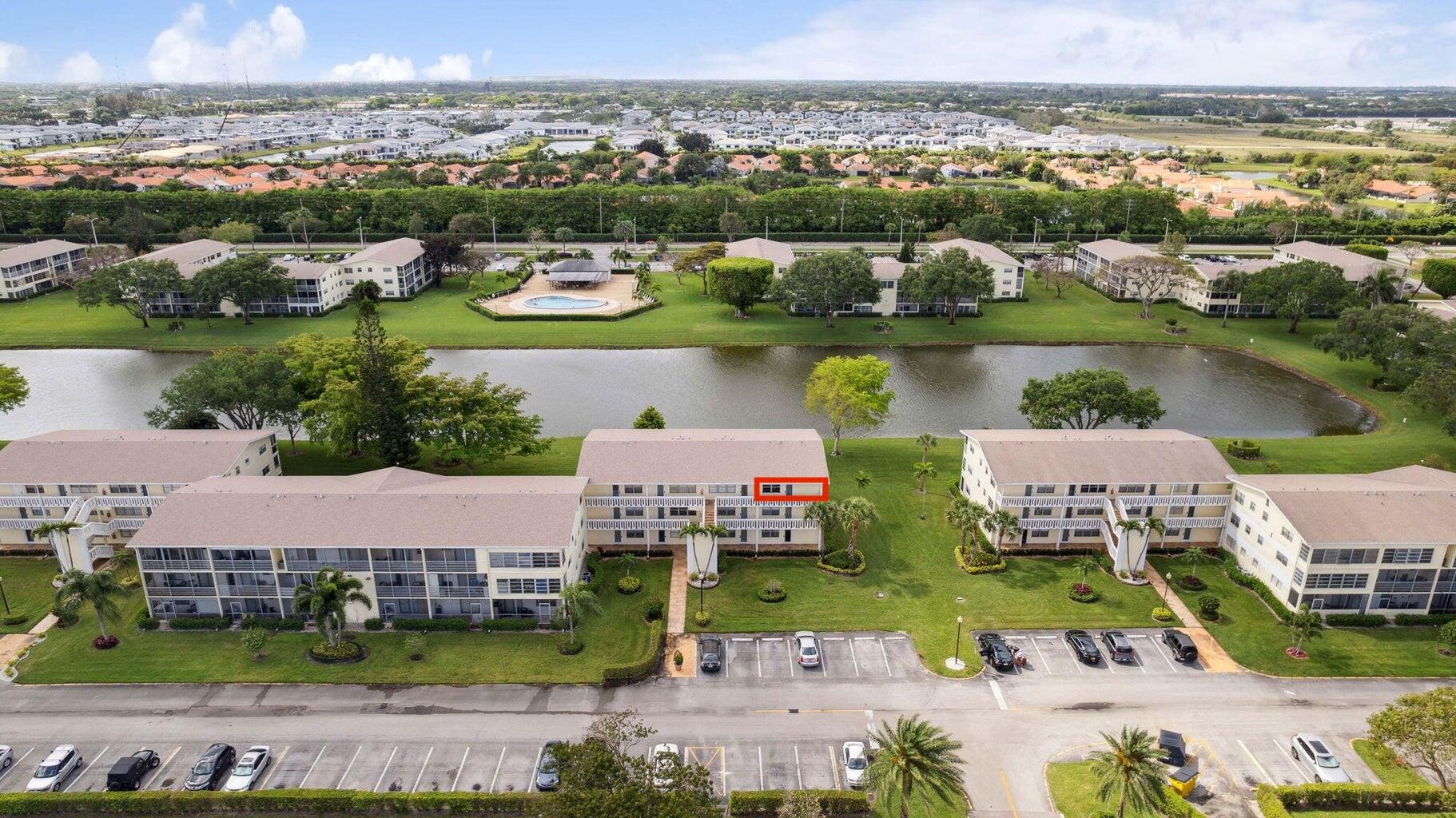 an aerial view of a house with a lake view