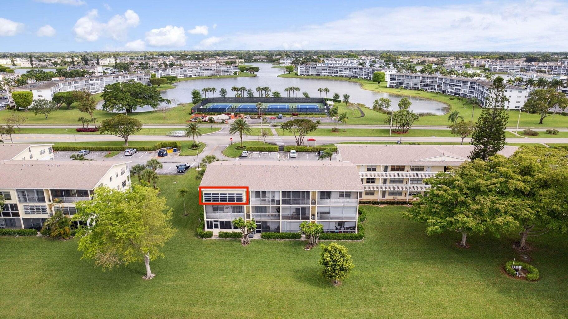336 Dorset H Boca Raton, FL 33434 - Photo 3 of 12 an aerial view of residential houses with outdoor space and swimming pool