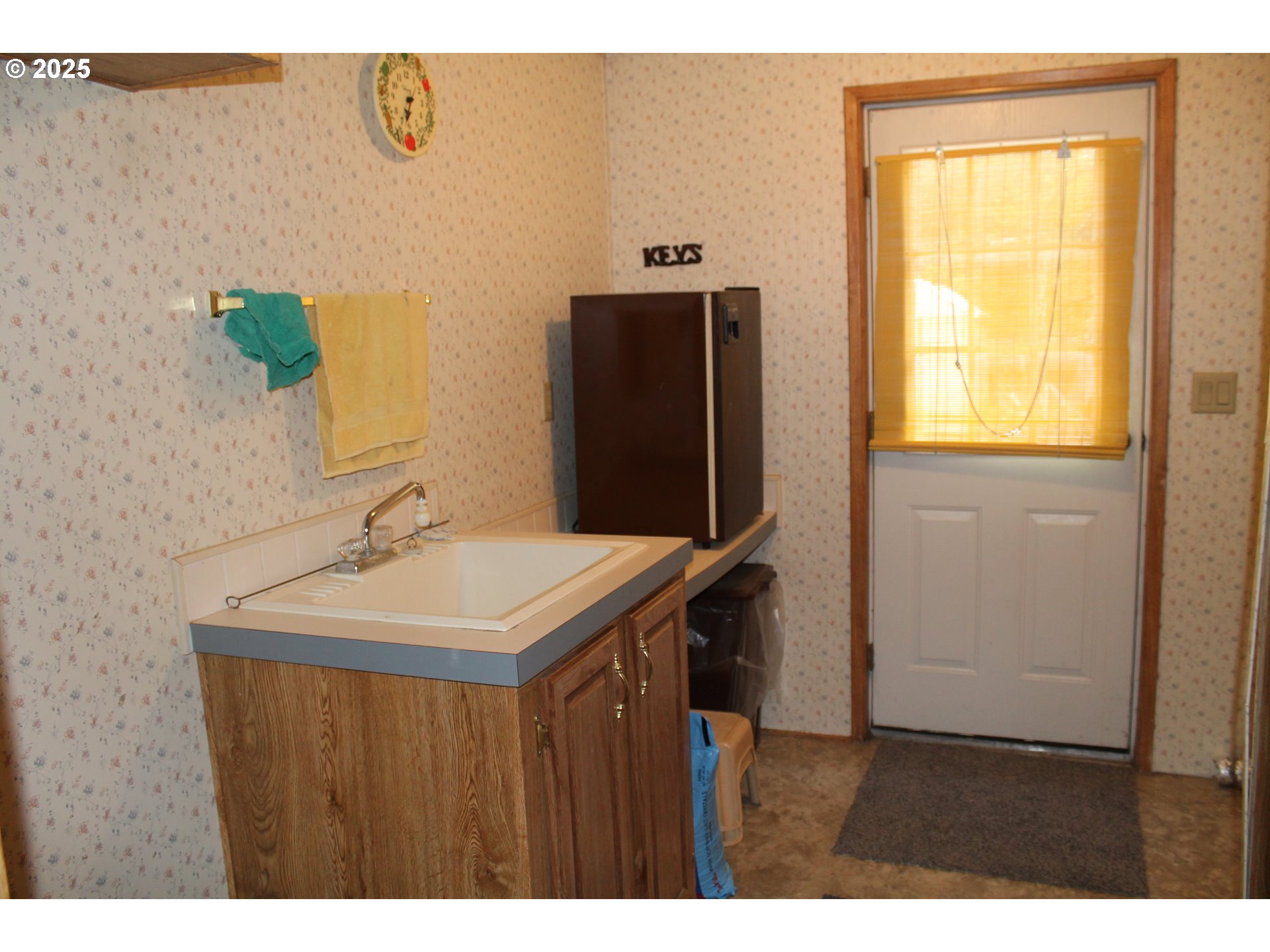 210 Mountain Boulevard Mount Vernon, OR 97865 - Photo 15 of 23 a bathroom with a sink a mirror and a window