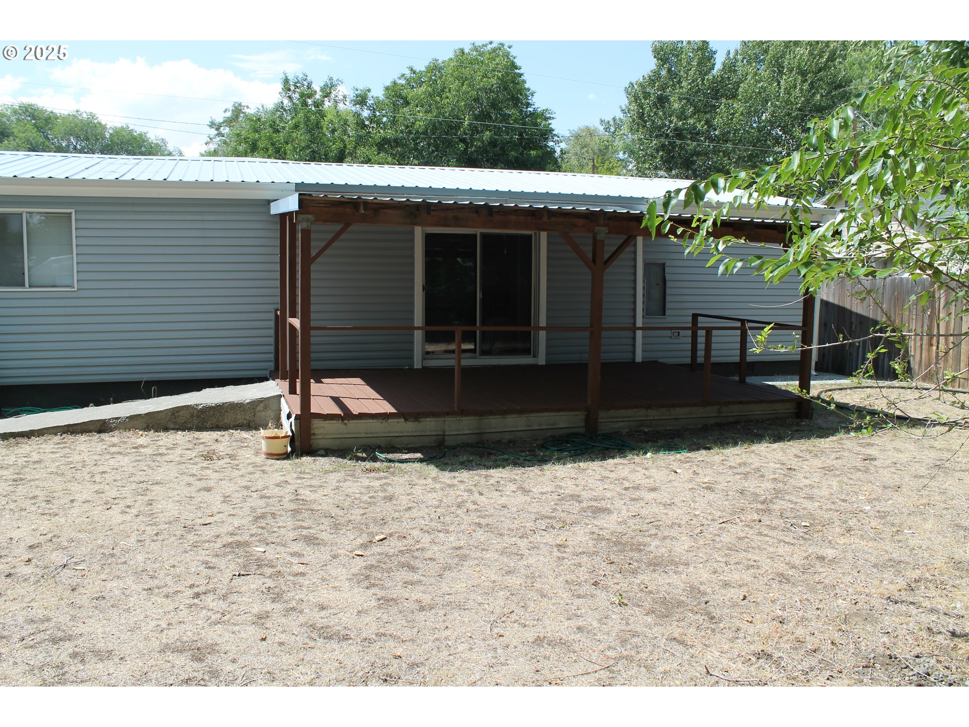 210 Mountain Boulevard Mount Vernon, OR 97865 - Photo 16 of 23 a backyard of a house with wooden fence