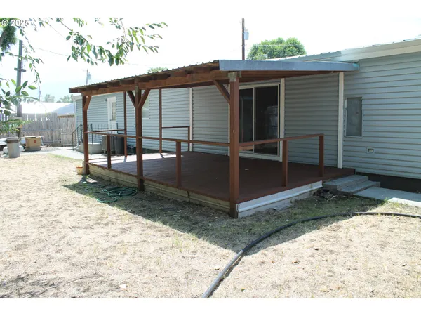 a view of backyard with deck