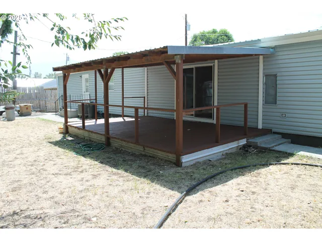 a view of backyard with deck
