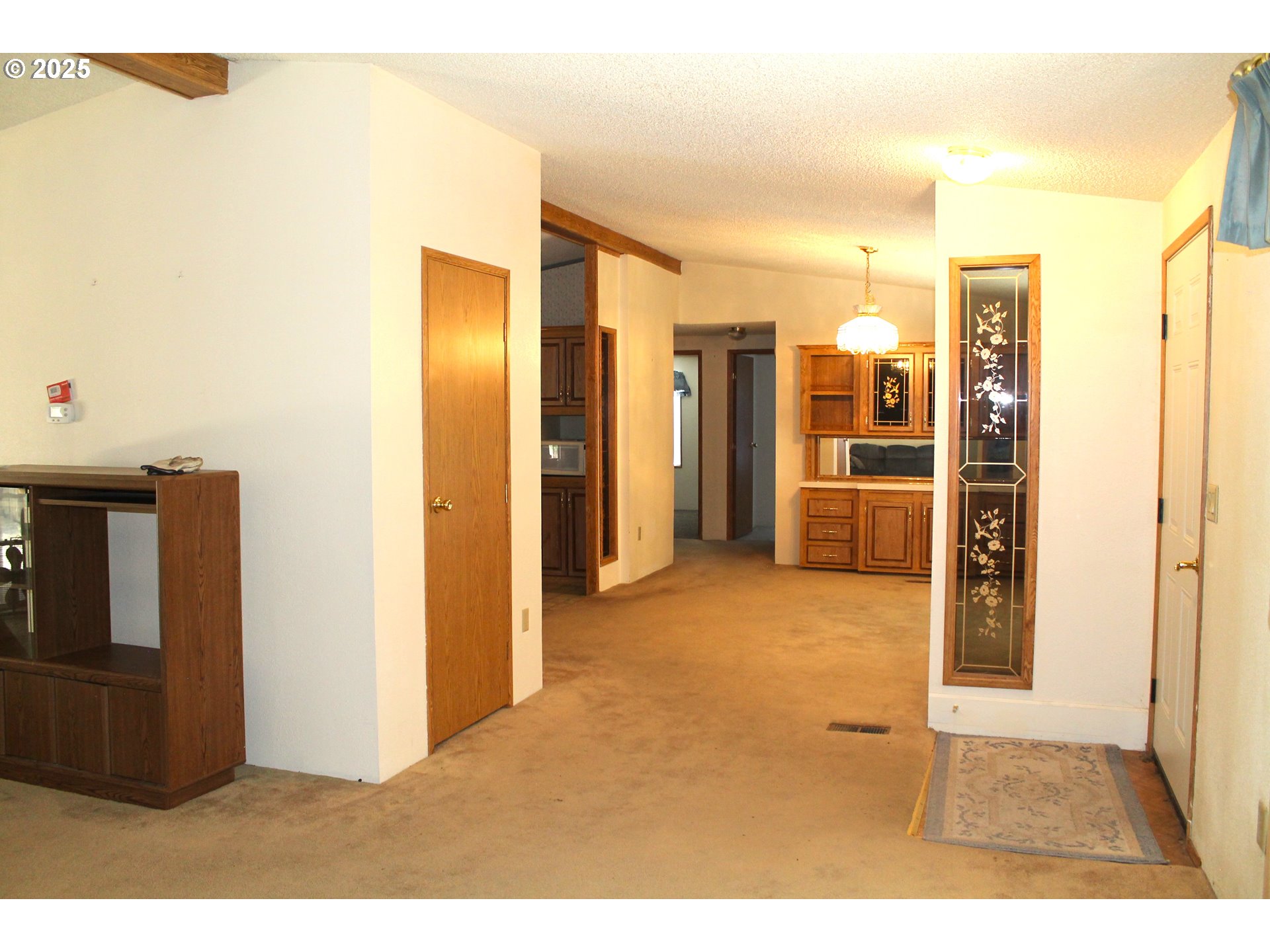 210 Mountain Boulevard Mount Vernon, OR 97865 - Photo 3 of 23 a view of a kitchen with refrigerator and door