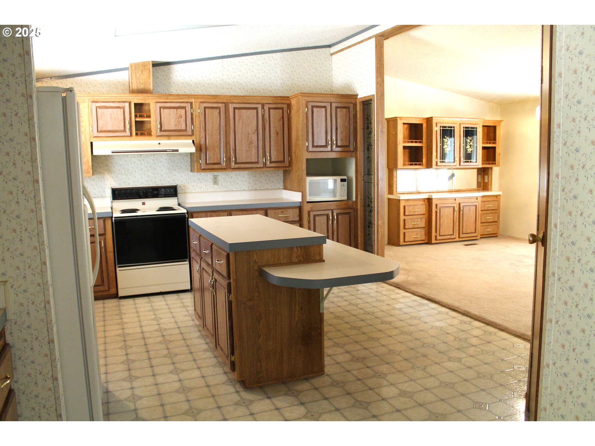 210 Mountain Boulevard Mount Vernon, OR 97865 - Photo 6 of 23 a kitchen with stainless steel appliances granite countertop a sink and stove