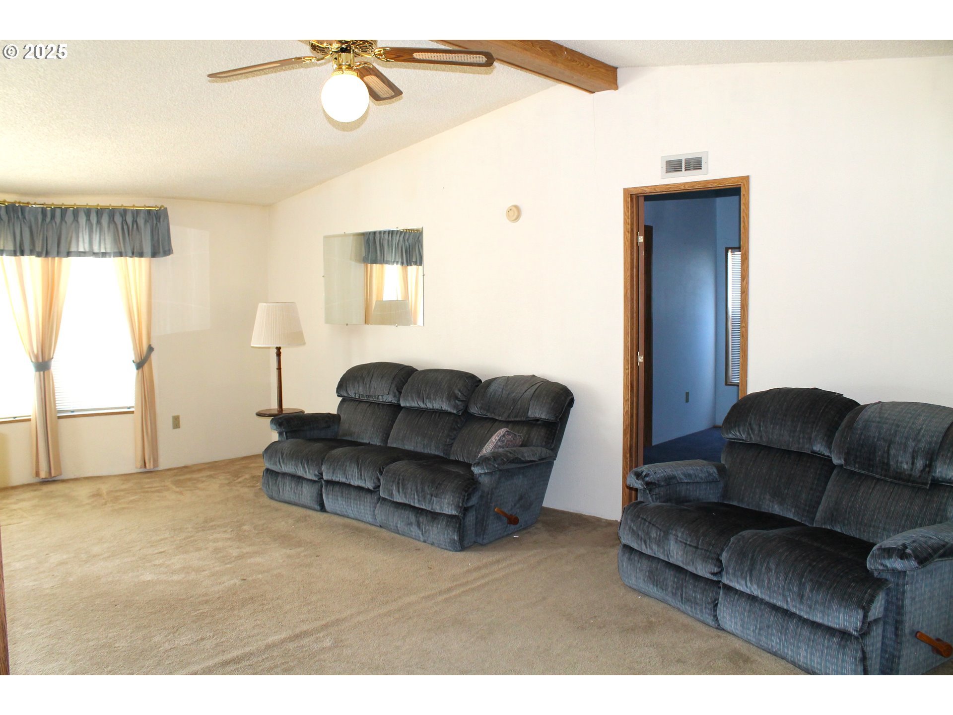 210 Mountain Boulevard Mount Vernon, OR 97865 - Photo 8 of 23 a living room with furniture and a window