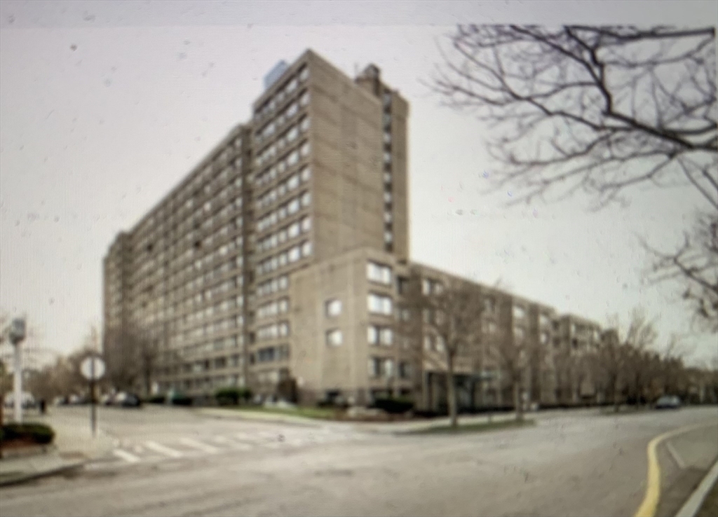 1731 Beacon Street, Unit 1213 Brookline, MA 02445 - Photo 1 of 29 a tall building sitting next to a road