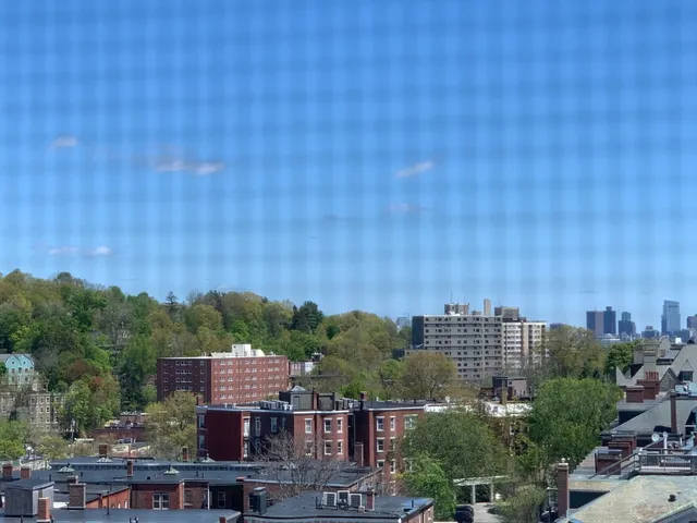 a view of a city with tall buildings