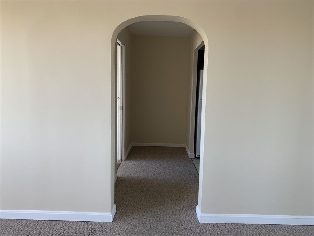 1731 Beacon Street, Unit 1213 Brookline, MA 02445 - Photo 23 of 29 a view of a hallway