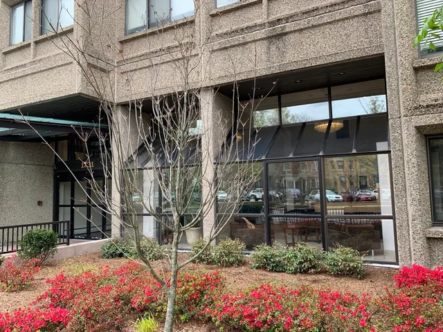 a view of a street with sitting area